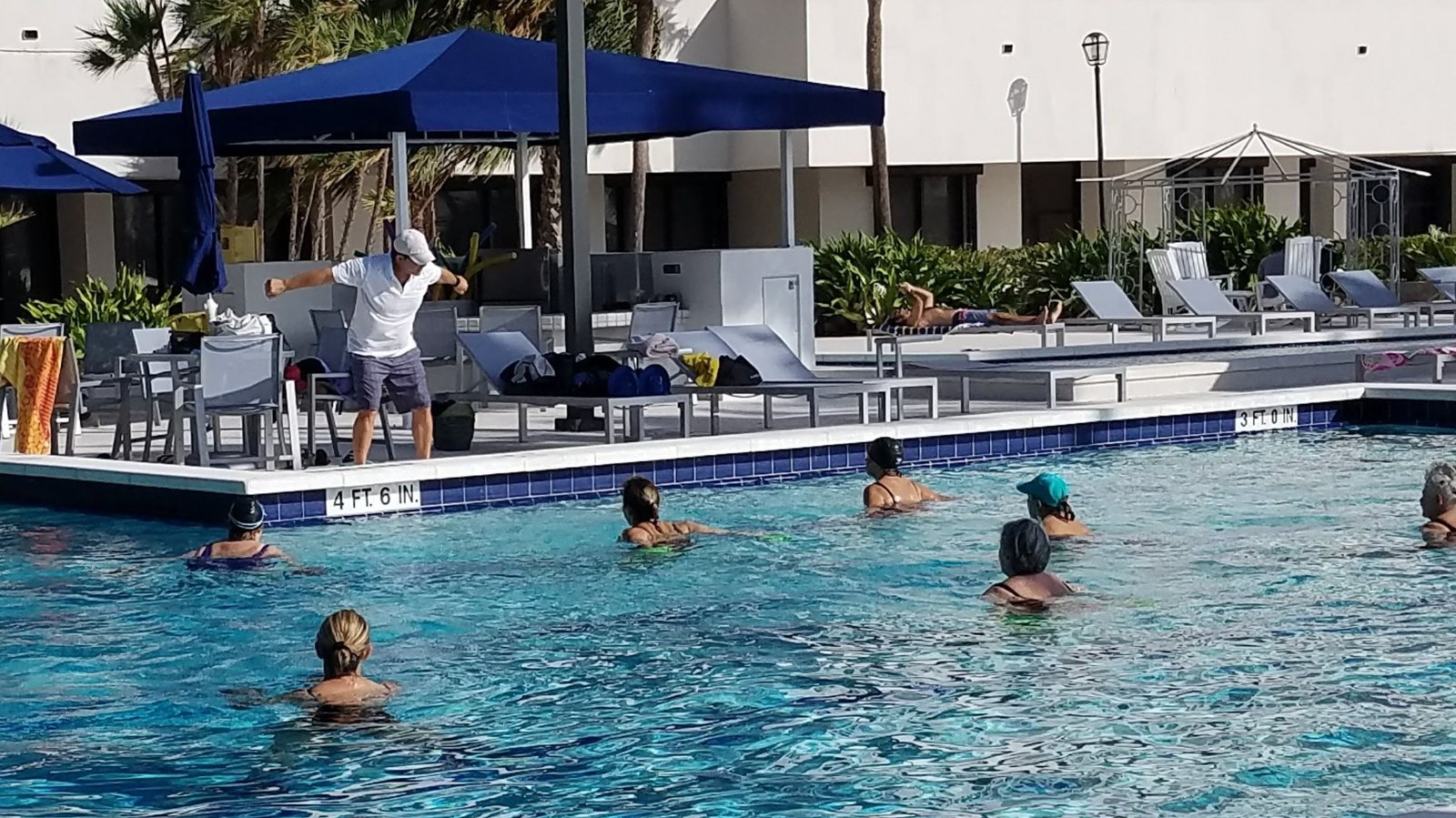 AquaFit Sports outdoor class in a luxury pool setting