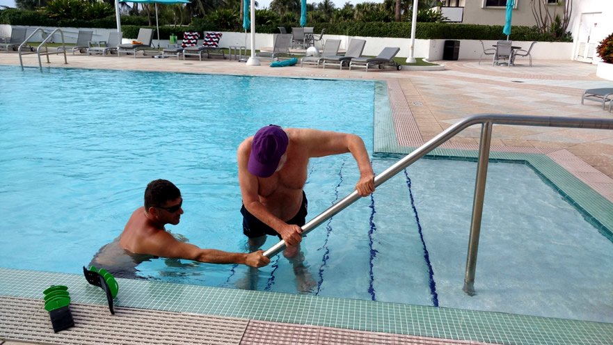 Client entering pool for aquatic recovery