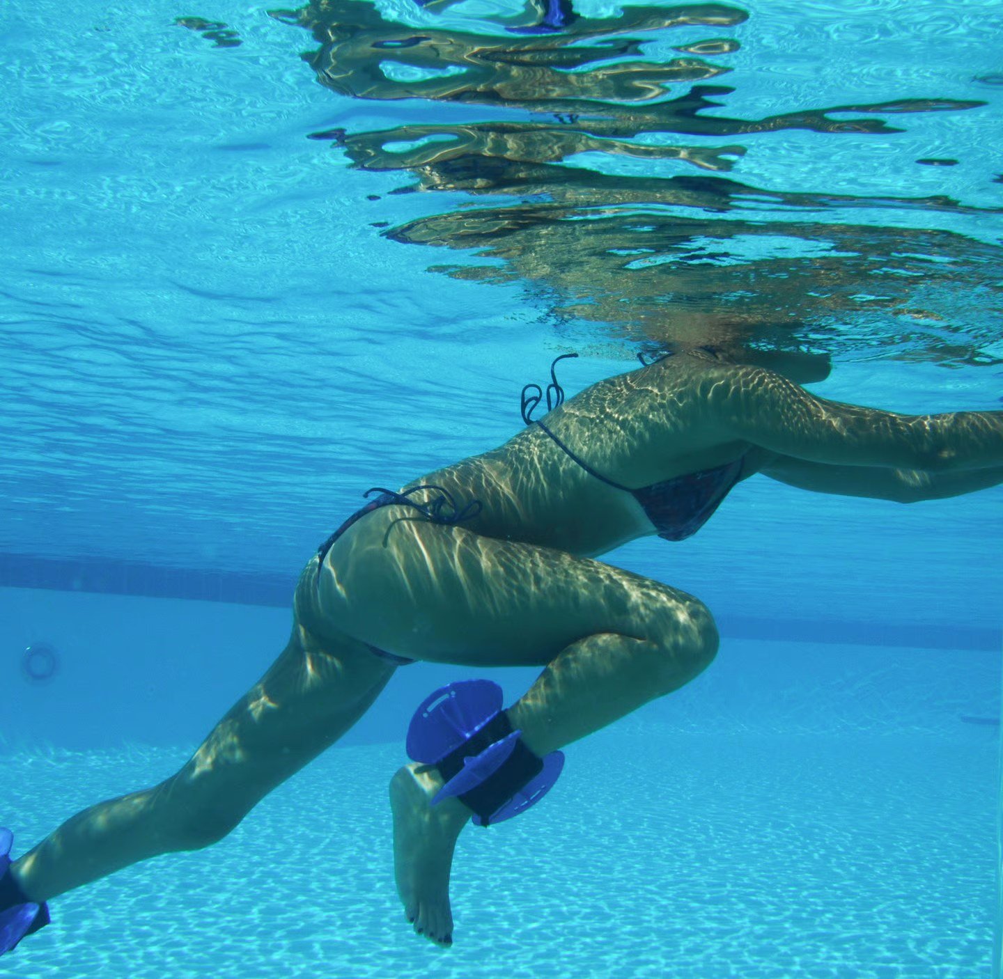 Client training underwater in a condo pool