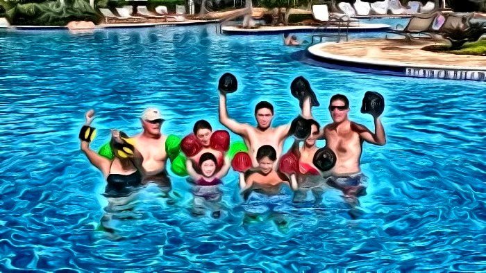 Family group participating in AquaFit session in the pool